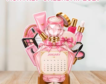 Peut inclure: Un calendrier mensuel 2027 présentant un design de flacon de parfum rose en forme de diamant avec une page de janvier. Le calendrier est entouré d'illustrations d'articles de maquillage dont du rouge à lèvres, un pot de crème et une palette.