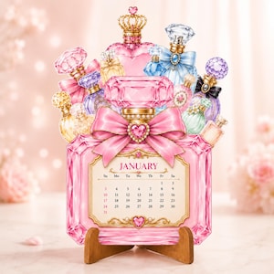May include: A decorative January calendar shaped like a large, faceted pink perfume bottle with a prominent pink bow and heart-shaped gem. The design features an arrangement of various colourful perfume bottles in the background on a wooden stand.
