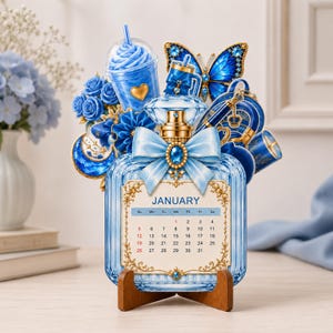 May include: A decorative January calendar shaped like a light blue glass perfume bottle with a gold cap and bow. It features a blue butterfly, roses, a crescent moon, and a drink cup. The calendar is supported by a small wooden stand.