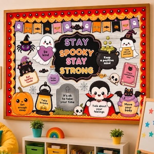 May include: A rectangular Halloween-themed bulletin board featuring a black border with orange circles. The centre text reads STAY SPOOKY STAY STRONG, surrounded by cartoon illustrations of ghosts, a pumpkin, a vampire, and a cauldron with text.