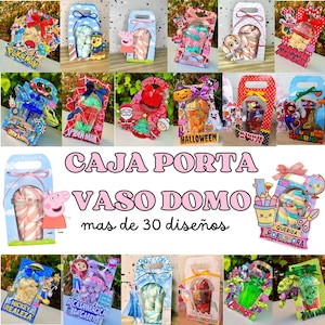 Può includere: Assortimento di scatole regalo colorate con vari personaggi dei cartoni animati e temi, tra cui Pokemon, Spider-Man e Super Mario. Ogni scatola contiene un bicchiere trasparente con un dolcetto a strisce. Il testo "CAJA PORTA VASO DOMO" è presente.