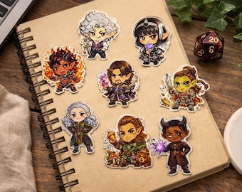 Puede incluir: Una colección de pegatinas con temática de fantasía que presentan varios personajes con diseños y colores únicos. Las pegatinas están dispuestas en un cuaderno de espiral, junto con un dado de veinte caras, lo que sugiere un tema de juego de mesa.