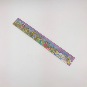 May include: A vintage 12-inch ruler with a colorful illustration of children, rainbows, and a unicorn. The ruler has a purple border and is made of a durable material. The design is whimsical and nostalgic, perfect for school or craft projects.
