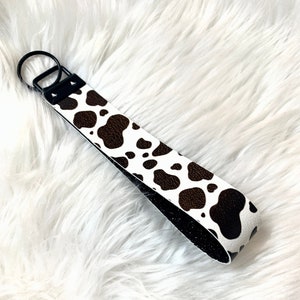 Cow Print Glitter Wristlet / Llavero / Piel sintética / Blanco y Negro / Llavero