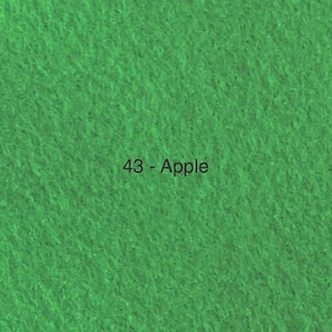 May include: A close-up of a textured, apple green fabric. The text "43 - Apple" is centered on the fabric. The fabric has a slightly rough, felt-like appearance, with a consistent colour throughout.