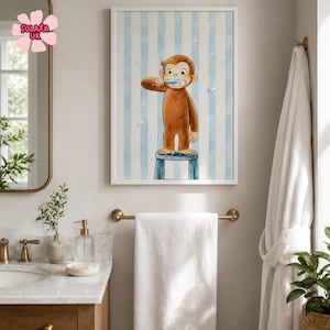 May include: A framed wall art print featuring a brown monkey standing on a blue stool while brushing its teeth with a blue toothbrush. The background consists of vertical light blue and white stripes with small white bubbles and star accents.