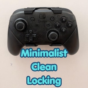 May include: Black Nintendo Switch Pro Controller with X, Y, A, and B buttons. The controller features a D-pad, two analogue sticks, and the Nintendo Switch logo. The text "Minimalist Clean Locking" is below the controller.