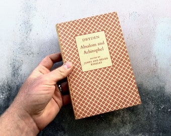 May include: A vintage book titled "Dryden Absalom and Achitophel" with a red and yellow patterned cover. The book is edited by James and Helen Kinsley.