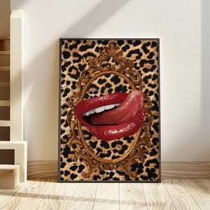 May include: A framed art print featuring a close-up of red lips with the tongue extended, set against a leopard print background. The lips are framed by an ornate gold-colored oval frame.