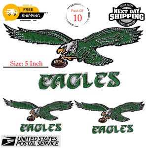 May include: Embroidered green and white Eagles patches, each featuring a detailed eagle holding a football. The patches are approximately 12.7 cm in size. The word "EAGLES" is embroidered below the eagle. The image also includes text about shipping.