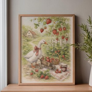 May include: A framed print featuring a charming illustration of a white goose with a pink bow, a wheelbarrow, and a basket filled with strawberries. A jar of jam and a small cottage are also visible in the scene. The artwork is set in a garden.