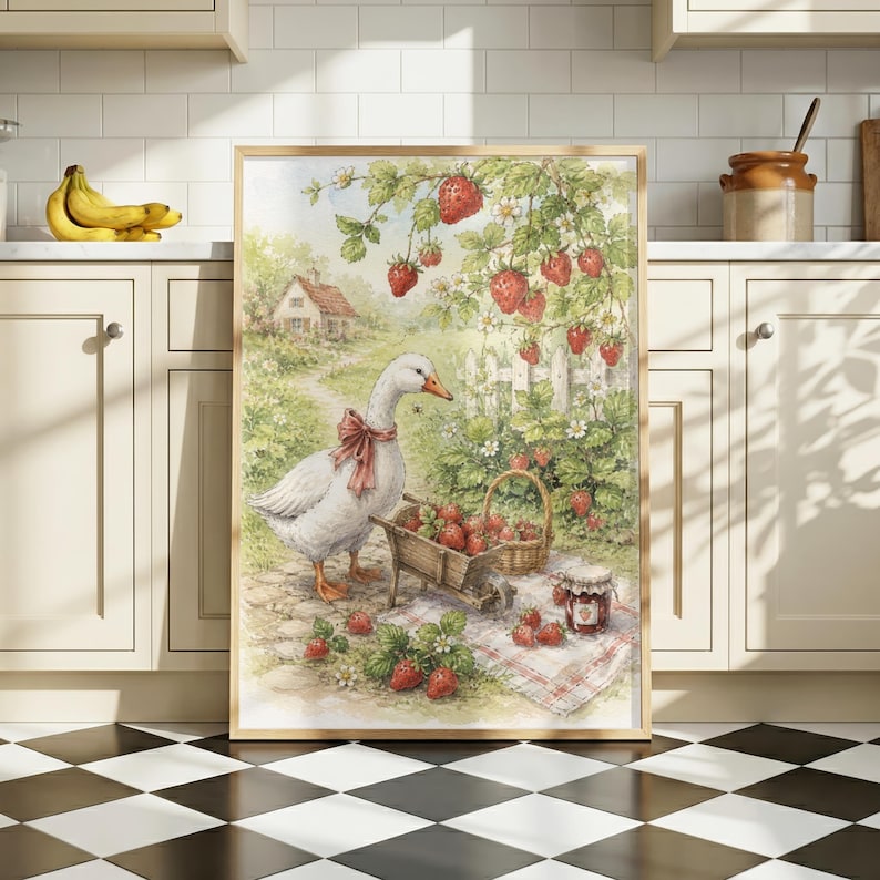 May include: Framed watercolor print featuring a white goose with a red bow, a wheelbarrow, and a basket filled with strawberries. The artwork depicts a charming rural scene with a house, a white fence, and strawberry plants.