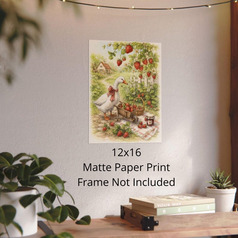 May include: A 12x16 matte paper print featuring a charming illustration of a goose with a red bow, surrounded by strawberries. A basket and a jar of jam are also present. The print has a vintage, pastoral aesthetic.