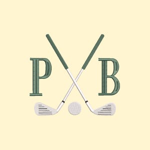 Peut inclure: Motif brodé avec des clubs de golf croisés, une balle de golf et les lettres "P" et "B" en vert. Les clubs ont des poignées vertes et des manches blancs. Le fond est de couleur jaune clair.