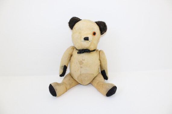 large tatty teddy bear