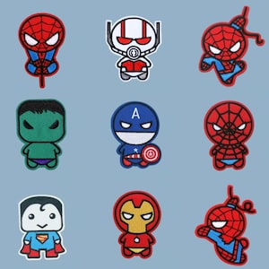 May include: Nine colourful embroidered patches featuring various superhero characters. The patches include Spider-Man, Ant-Man, Hulk, Captain America, Superman, and Iron Man. Each patch is a unique design with vibrant colours and detailed stitching.