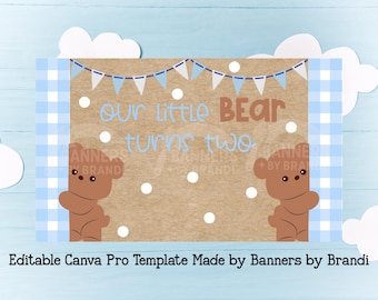 May include: A rectangular banner template featuring a brown kraft paper background with white polka dots, a blue and white bunting, and two brown teddy bears on the sides. The text reads our little BEAR turns two in blue and brown letters.