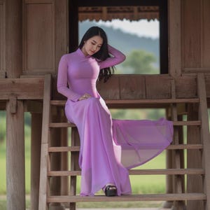 May include: A set of three ceramic mugs with a speckled, matte finish in cream, light grey, and dark grey. Each mug has a simple, modern design and a rounded handle. Ideal for tea or coffee.