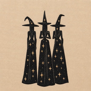 May include: An embroidery design featuring three figures wearing tall pointed hats and long gowns. The figures are stitched in black thread with gold-coloured star motifs scattered across their hats and dresses, set against a light beige fabric background.