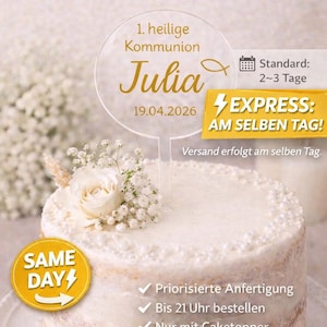 Può includere: Una torta glassata bianca con un topper in acrilico trasparente. Il topper riporta il nome "Julia" e la data "19.04.2026" in oro. La torta è decorata con fiori bianchi e il testo "Express-Bearbeitung".