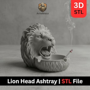 May include: A gray lion head ashtray with an open mouth and a bowl-shaped receptacle. A lit cigarette rests in the ashtray. The text "Lion Head Ashtray | STL File" is at the bottom of the image.