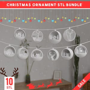 May include: A collection of white Christmas ornaments with winter scenes and reindeer designs. The ornaments are suspended from a string, decorated with stars and baubles. The text "CHRISTMAS ORNAMENT STL BUNDLE" is visible at the top.