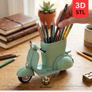 May include: A light green scooter-shaped pencil holder containing various colored pencils. The holder features a front wheel, handlebars, and a seat, with a central compartment for stationery. A red tag in the corner displays the text 3D STL.