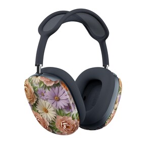 May include: Over-ear headphones with a floral design. The earcups feature a pattern of peach, white, and purple flowers. The headband and earcups are a dark gray color. The headphones are designed for listening to music.