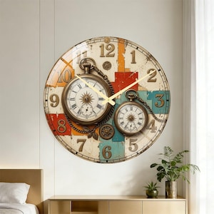 May include: A round wall clock featuring a distressed background with red, orange, and teal rectangular blocks. The clock face displays large black Arabic numerals and two integrated pocket watch designs with Roman numerals and gold-colored hands.