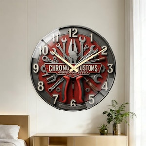 May include: Round wall clock with a red and gray face featuring various tools. The clock face has the text "CHRONO KUSTOMS AMERICAN GARAGE GEAR EST. 1968" and the numbers 1 through 12. The clock hands are gold.