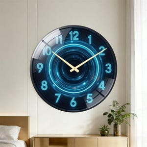 May include: A round wall clock featuring a dark blue background with a glowing cyan neon-style circular tunnel pattern. The clock face displays bright cyan numbers from 1 to 12 and includes two thin, gold-colored hands for the hour and minute.