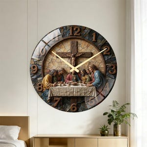 May include: A round wall clock featuring a detailed depiction of the Last Supper. The clock face has Roman numerals and gold-colored hands. The background is a stone-like texture, and the clock is mounted on a beige wall.