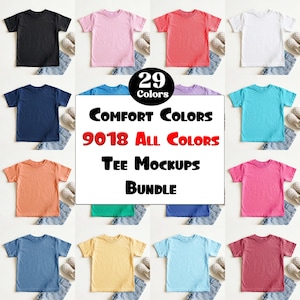 May include: A collection of twenty-nine short-sleeved t-shirts in various solid colors, including black, pink, red, white, navy, turquoise, orange, and yellow. A central white sign displays the text 29 Colors Comfort Colors 9018 All Colors Tee Mockups Bundle.