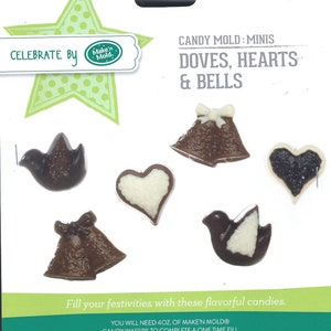 May include: A white card with a green star and the text "Celebrate By Make'n Mold."  The card shows a candy mold for making chocolate doves, hearts, and bells. The mold is labeled "Candy Mold: Minis Doves, Hearts & Bells".