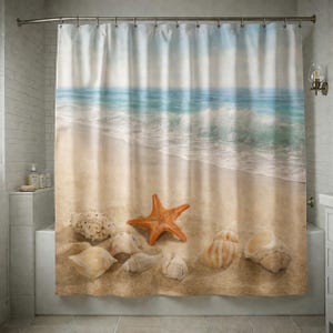 May include: Shower curtain depicting a beach scene. The curtain shows a sandy beach with seashells and a starfish. The ocean is in the background with blue and white waves. The curtain is hung on a silver rail.