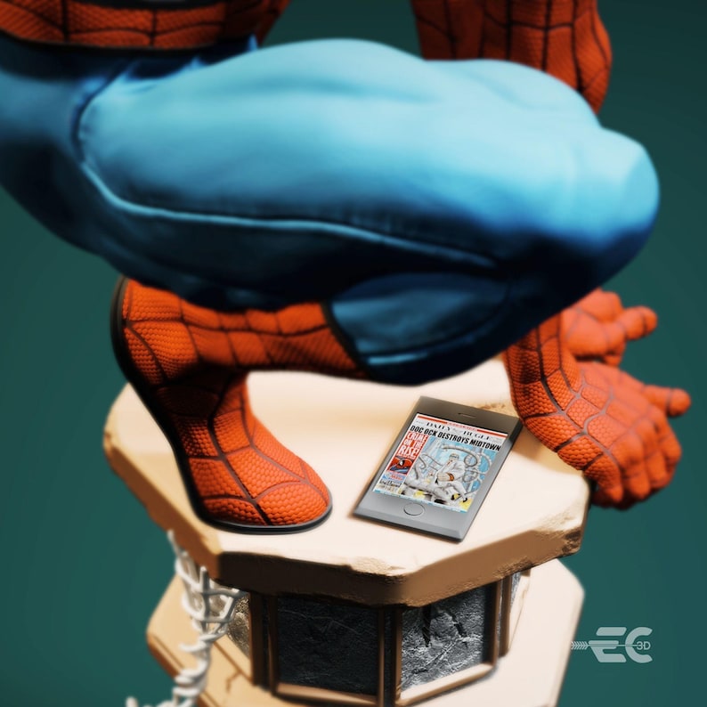May include: A detailed figurine of Spider-Man in a crouching pose, with red and blue costume. A small tablet displays a comic book cover with the headline "Doc Ock Destroys Midtown". The figurine rests on a stone-like pedestal.