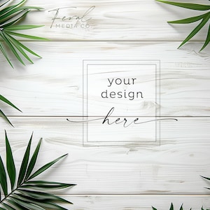 May include: Whitewashed wood background with a black frame that says "your design here" and green palm leaves on the sides.