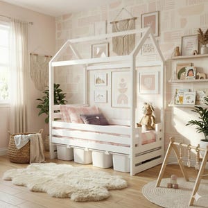 May include: A white wooden house-shaped bed frame with a mattress, pillows, and storage bins underneath. The room features a rug, a woven basket, and framed artwork on the wall. A stuffed animal sits on the bed.
