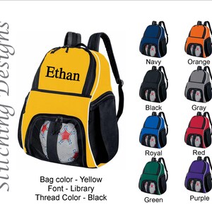 May include: Yellow backpack with the name "Ethan" in black lettering. The backpack has black mesh pockets and a white trim. Additional backpacks in navy, orange, black, gray, royal blue, red, green, and purple are also shown.