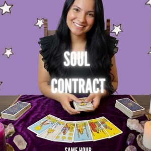 May include: A woman smiles, holding tarot cards on a table with a purple velvet cloth. The text "SOUL CONTRACT" and "SAME HOUR" are displayed. Tarot cards are laid out, with candles and crystals nearby.