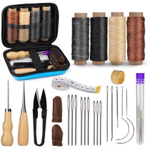 May include: A sewing kit with various tools and supplies. The kit includes spools of thread in multiple colors, needles, scissors, a thimble, a measuring tape, and other accessories. The kit is stored in a blue zippered case.