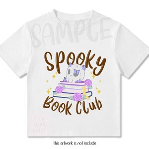 May include: A white short-sleeved t-shirt featuring a graphic print of a skull resting on a stack of books, surrounded by purple roses and butterflies. The text "SPOOKY BOOK CLUB" is printed in brown above and below the central illustration.