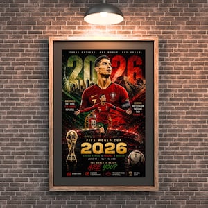 May include: A framed poster featuring Cristiano Ronaldo in a red Portugal jersey, the FIFA World Cup 2026 logo, the trophy, and a football. The text reads 2026, Three Nations, One World, One Dream, Greatness Isn't Born, It's Earned, Repeated, and Are You?