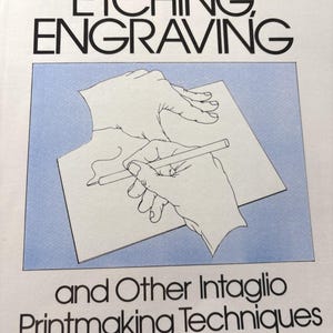 May include: A book cover titled "Etching, Engraving" by Ruth Leaf. The cover features a blue rectangle with a drawing of hands holding a pencil over a paper. The text "and Other Intaglio Printmaking Techniques" is below the drawing.