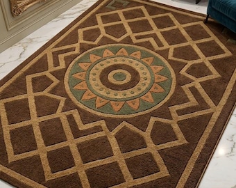 May include: A brown rectangular rug with a geometric design. The rug has a central circular motif in green, tan, and orange, framed by a repeating tan geometric pattern. The rug is placed on a marble floor, suitable for a living room.