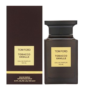 May include: A Tom Ford Tobacco Vanille Eau de Parfum bottle and box. The bottle is a dark brown square shape with a black cap. The box is dark brown with gold lettering. The text on the bottle and box reads "Tom Ford Tobacco Vanille Eau de Parfum 100 ML".