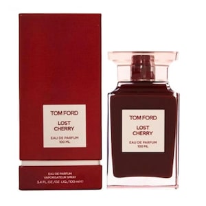 May include: A Tom Ford "Lost Cherry" Eau de Parfum bottle and box. The dark red bottle has a clear top and a white label. The box is a matching dark red with white text. The bottle contains 100 ml (3.4 fl oz).