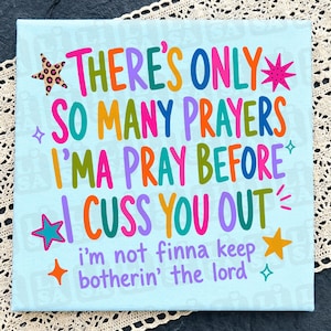 May include: A light blue square fabric panel featuring the colorful text "THERE'S ONLY SO MANY PRAYERS I'MA PRAY BEFORE I CUSS YOU OUT" and "i'm not finna keep botherin' the lord" surrounded by various small star shapes in pink, orange, and teal.