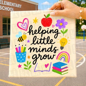 May include: A canvas print with the words "helping little minds grow" in black script, surrounded by colorful illustrations of a heart, apple, bee, pencils, flower, lightbulb, rainbow, and books. The background is a schoolyard.