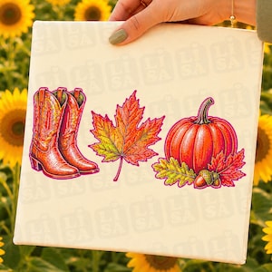 May include: A white rectangular surface featuring a colorful graphic print of a pair of orange cowboy boots, a large maple leaf in shades of red, orange, and yellow, and a bright orange pumpkin accented with smaller oak leaves and an acorn.